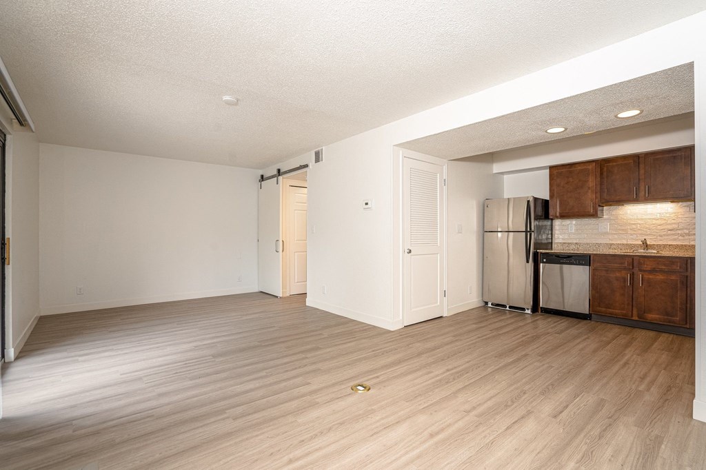 a kitchen and living room in a 555 waverly unit